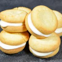 Sugar Cookie Sammies (5) · A layer of creamy cheesecake in between two bite sized sugar cookies. Includes 5 cookies.