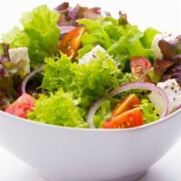 Garden Salad · Romain lettuce , spring mix, tomato, red onions, carrots, crispy croutons, Parmesan cheese w...