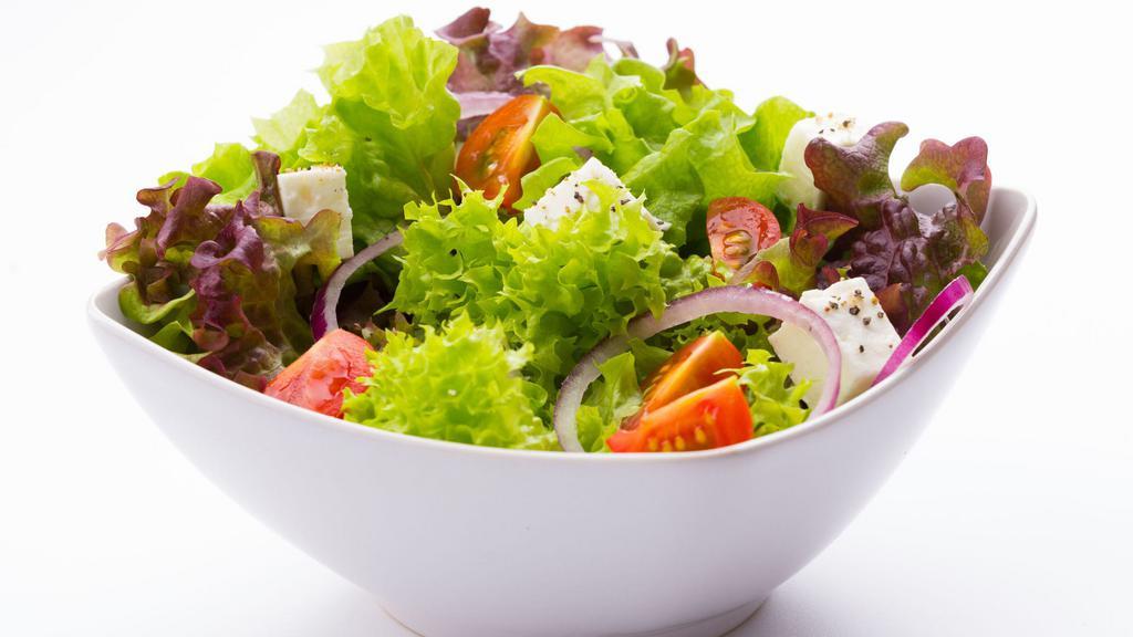 Garden Salad · Romain lettuce , spring mix, tomato, red onions, carrots, crispy croutons, Parmesan cheese with ranch dressing.
