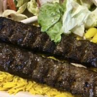 Kofta Kabob Plate · 2 Skewers of Kofta (Ground Beef & Lamb) served on a bed of rice and choice of 2 sides and a ...