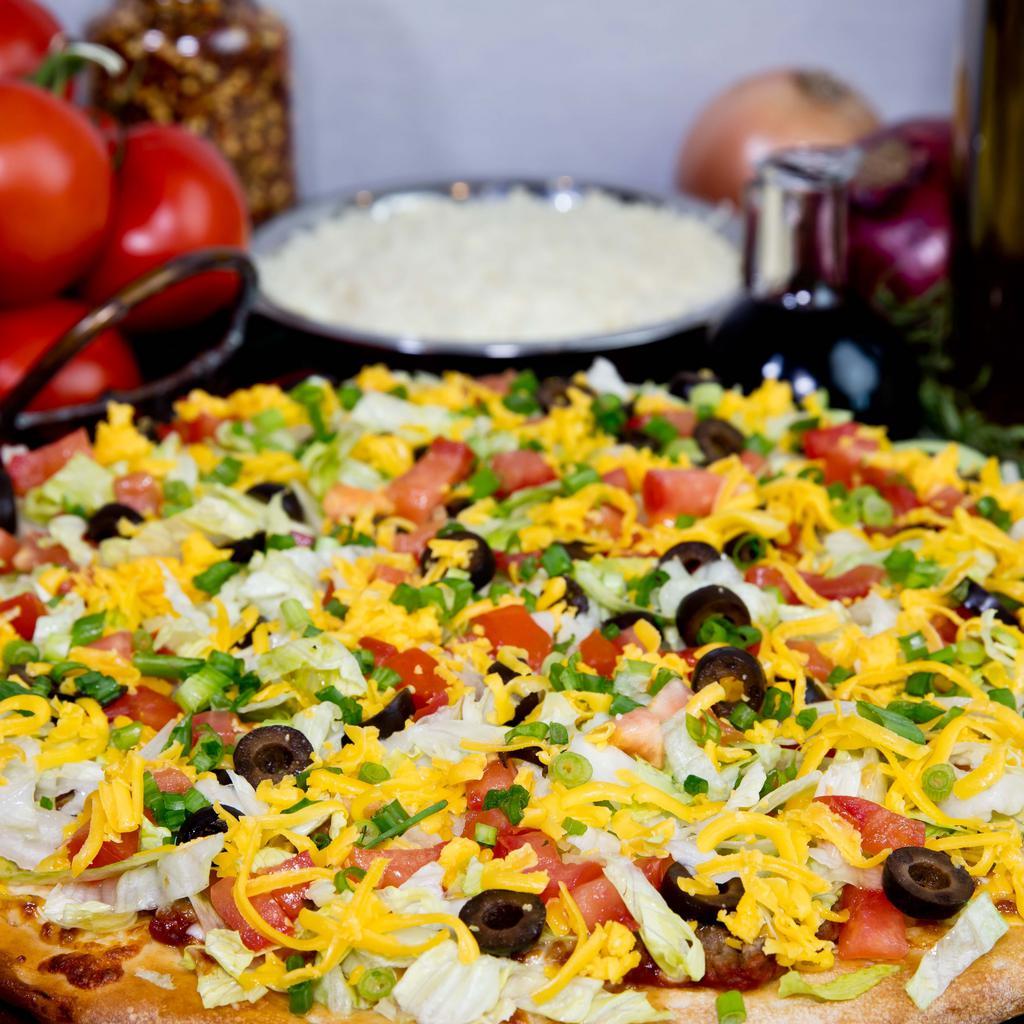 Taco Pizza · Taco sauce, original crust, mozzarella & cheddar cheese, beef, lettuce, green onions, black olives & fresh tomatoes.