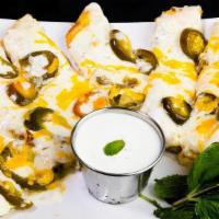 Jalapeno Bread · Cheesy garlic bread sticks smothered with creamy white garlic sauce and topped with mozzarel...