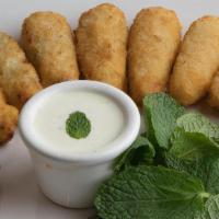Cream Cheese Poppers (10Pc) · Freshly baked breaded poppers with tator tots cream cheddar cheese and jalapeño filling.