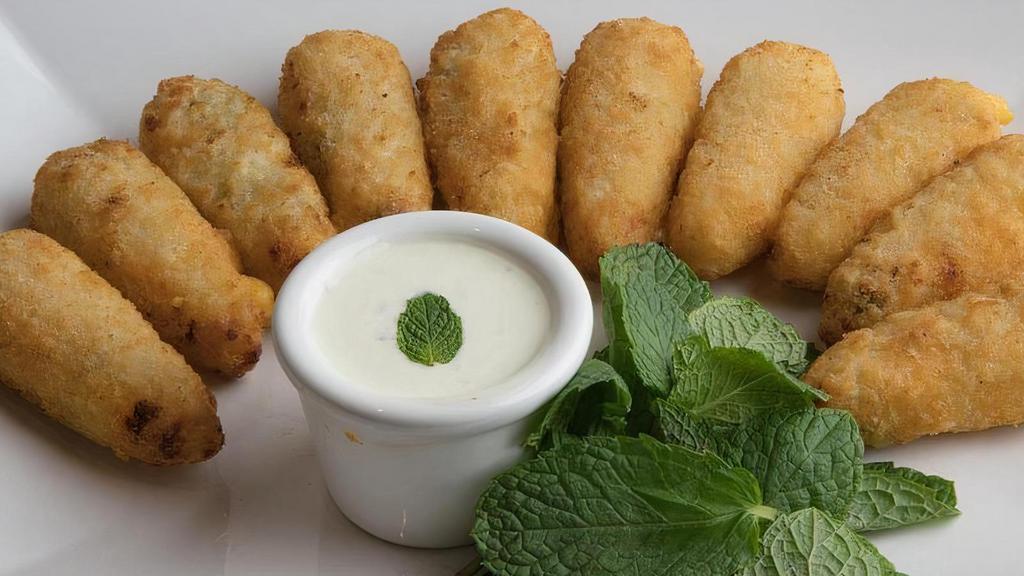 Cream Cheese Poppers (10Pc) · Freshly baked breaded poppers with tator tots cream cheddar cheese and jalapeño filling.
