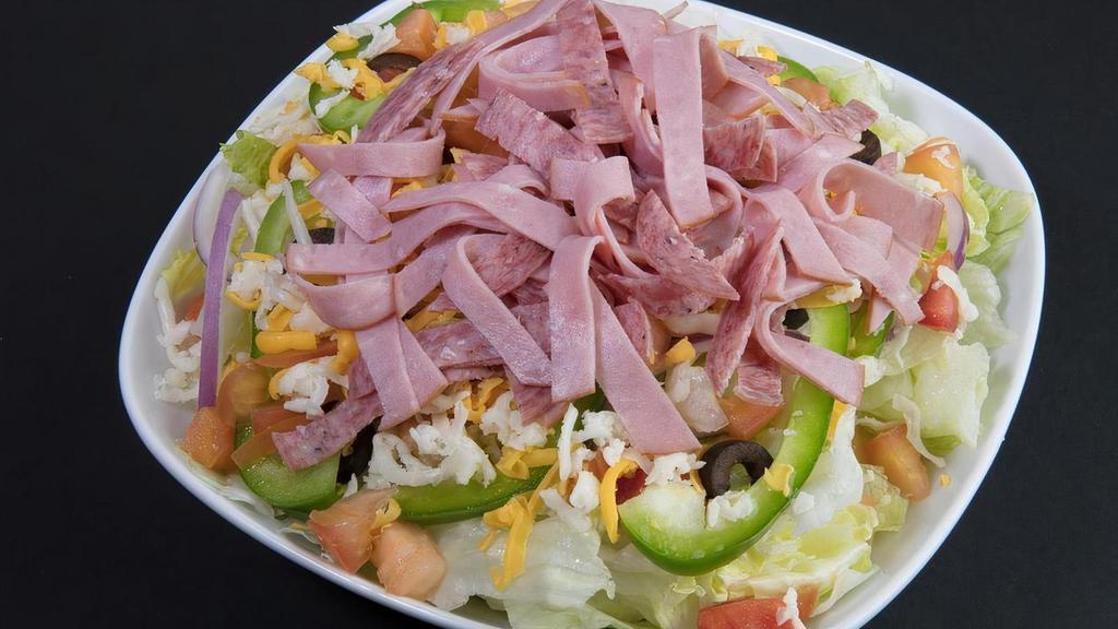 Antipasto Salad · Iceberg lettuce, bell peppers, red onions, black olives, Canadian bacon, Italian dry salami, fresh tomatoes, mozzarella cheese, cheddar cheese and seasoned croutons.