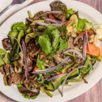 Siam Beef Salad · Gluten-free. Grilled marinated beef, tomato, cucumber, carrot, mixed greens, red onion, cila...