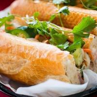 Bbq Pork Banh Mi Sandwich · BBQ pork, pork pate, cucumber, house-made pickled daikon & carrots, jalapeno, and cilantro o...