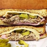 Cubano Sandwich · Ham, shredded pork, pickled cucumber, swiss cheese, and  Dijon mustard on brioche.