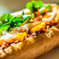 Al Pastor Banh Mi Sandwich · Al pastor, roasted salsa, pineapple, cucumber, house-made pickled daikon & carrots, jalapeno...