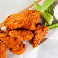 Spicy Wings · Ten deep-fried crispy wings tossed in a sweet & spicy Sriracha glaze and served with spicy m...