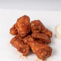 Buffalo Wings · The classic, not-crazy-spicy, tangy and creamy Buffalo wings we all know and love. Comes wit...
