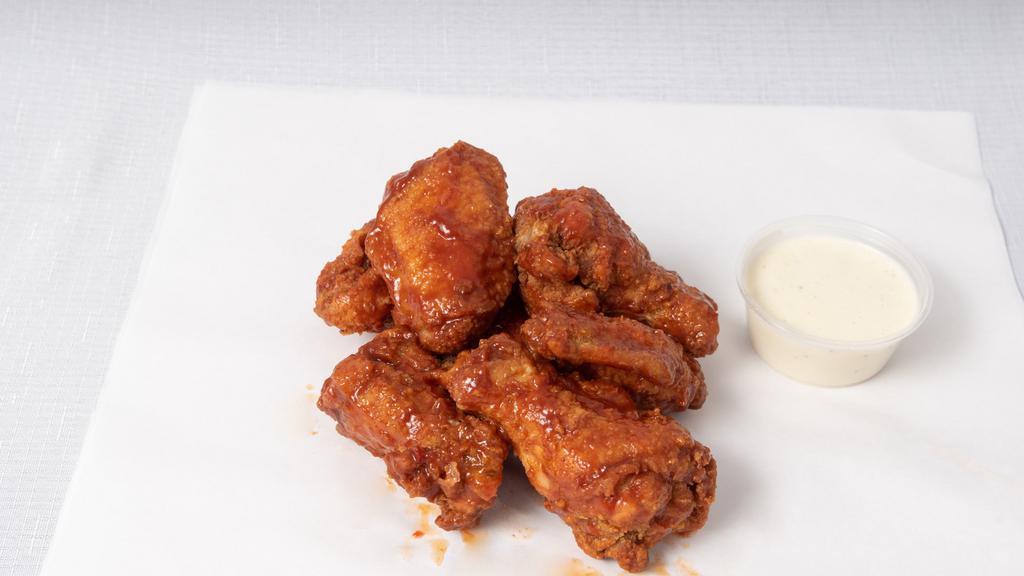 Buffalo Wings · The classic, not-crazy-spicy, tangy and creamy Buffalo wings we all know and love. Comes with celery sticks and the dipping sauce of your choice. - no half and half sauces. All wing orders come half drumettes, half flats (no substitutions - sorry, not sorry).
