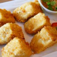 Ap16. Fried Tofu (6 Pcs.) · Deep fried tofu served with sweet & sour sauce.