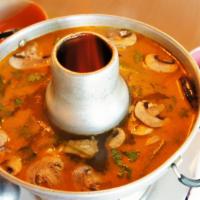 Seafood Soup · Crab, shrimps, squids, clams, mussels and fish in a hot spicy lemon soup.
