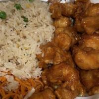 Orange Chicken · Deep fried chicken with sweet and sour sauce served with fried rice.