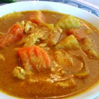 Yellow Curry · Chicken sautéed in coconut milk with carrots, potatoes & yellow chili paste.