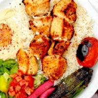Chicken Kabab Plate · Marinated chicken  served with rice, red onions, roasted tomato, pepper, hummus, lettuce sal...