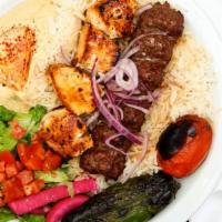 Combo Kabab Plate · Beef and chicken  kababs, served with rice, red onions, roasted tomatoes, pepper, lettuce sa...
