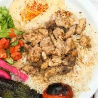 Chicken Shawerma Plate · Marinated chicken served with hummus, tahini, tomatoes, lettuce, pickles, red onion, garlic ...