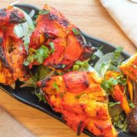 Tandoori Chicken-Full · Whole chicken marinated in exotic spices, cooked in clay oven.