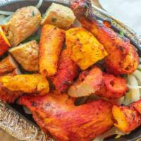 Mixed Grill · Combination Of Tandoori Chicken, Chicken Tikka, Sheekh Kebab, Lamb Boti, Kebab & Tandoori Fi...
