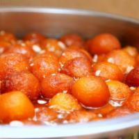 Gulab Jamun · Milk pastry dumplings served in a rose and honey syrup.