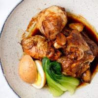 Adobo · Braised and simmered in soy-vinegar sauce, garlic, onions, peppercorns, bay leaves.