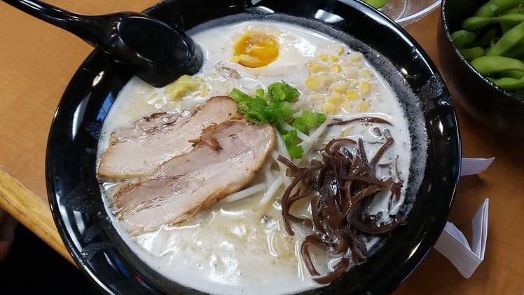 Miso Ramen · Tonkotsu soup base with rich miso flavor. Green onions, bean sprouts, wood ear mushrooms, fried garlic, corn, egg, and pork chashu for toppings.