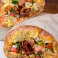 Breakfast Burrito  · Eggs, potatoes, beans, green chili, and cheese with bacon, sausage, or ham.