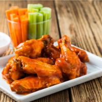 Buffalo Chicken Wings · Fresh buffalo wings, marinated in housemade buffalo sauce served with celery, carrots, and r...