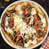 Philly Shawarma Loaded Fries · Beef shawarma, caramelized onions, bell peppers, and melted cheese topped on Idaho potato fr...