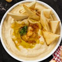 Hummus Plate · A mixture of mashed garbanzo beans, lemon juice and tahini, and garlic served with pita chips.