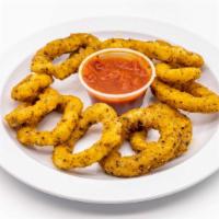 Onion Rings · Crispy golden onion rings served with a side of BBQ ranch.