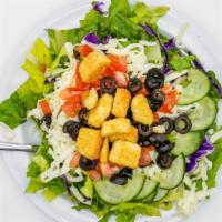 House Salad · Romaine lettuce mix topped with cherry tomatoes, cucumbers, mozzarella cheese, black olives,...