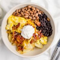 The Breakfast Bowl · Your Choice base, Your Choice Protein,  Egg, Potato, Cheese, and Sour Cream. Topped with Tor...