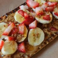 Peanut Butter & Banana  (And Strawberry!) Toast · Peanut Butter with Banana and strawberries granola & honey drizzle.  Perfect for kids and ad...