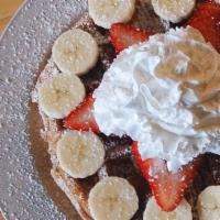 Breakfast Waffle · Cinnamon Belgian waffle coated with light butter, syrup,  whipped cream, and powdered sugar....