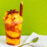 Chamango · 3 scoops of water based ice cream with chamoy tajin, topped off with fresh mango, tamarind p...