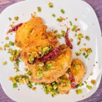 Salt Pepper Wings · Hot and spicy. Deep-fried wings with green onion and chili flakes.