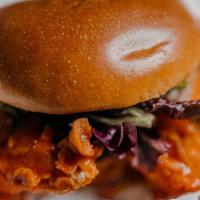 Buffalo Chicken Sandwich · Brioche bun, House-made Aioli sauce, spring mix, pickles, and chicken coated in our special ...