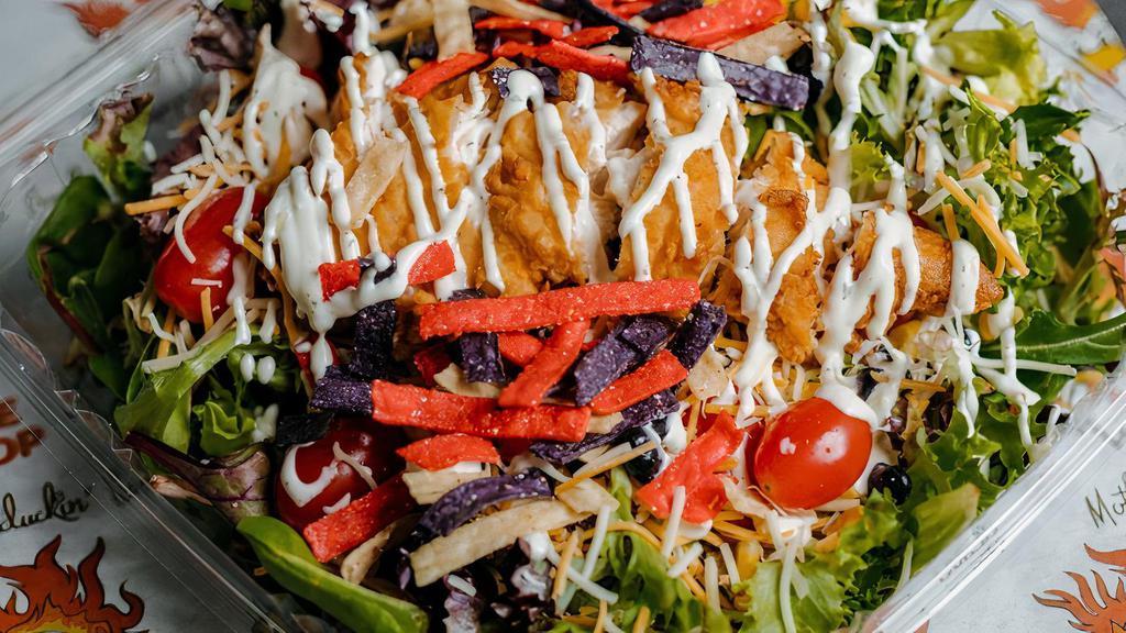 Southwest Chicken Salad · Green mix, corn, black beans, shredded cheese, baby tomatoes, red onions, crispy chicken, southwest dressing, tortilla chips.