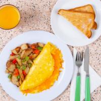 Cheese Omelette · Three egg omelette with gooey melted cheddar and swiss cheesse, served with buttered toast a...