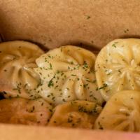 Chicken Dumplings (6Pc.) · Juicy steamed chicken dumplings.  Comes with sweet and tangy sauce