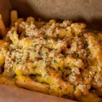 Garlic Fries · Fresh and crispy shoestring French fries with fresh garlic cloves and parmesan sauce drizzle...