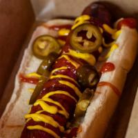 The Pub Dog  · Halal Pub hot dog served with ketchup mustard and jalapeños.