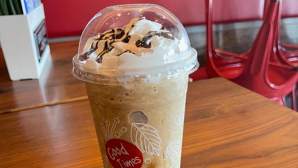 Mocha Shake · Blended iced mocha with two shots of our super strong espresso and chocolate drizzle with whipped cream on top