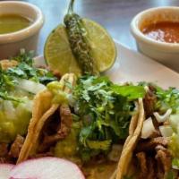 Mini Tacos (3) · Onion, cilantro and guacamole.