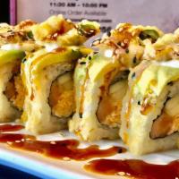 Kryptonite Roll · Deep-fried spicy imitation crab, salmon, cucumber and topped off with asparagus and avocado ...