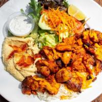 Chicken Shawarma Plate · Gluten free. Marinated chicken thigh and breast slowly cooked on a vertical rotisserie. Serv...