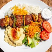 Shish Kabob Plate · Gluten free. Grilled marinated filet mignon. Served with white or brown rice, salad, and hum...
